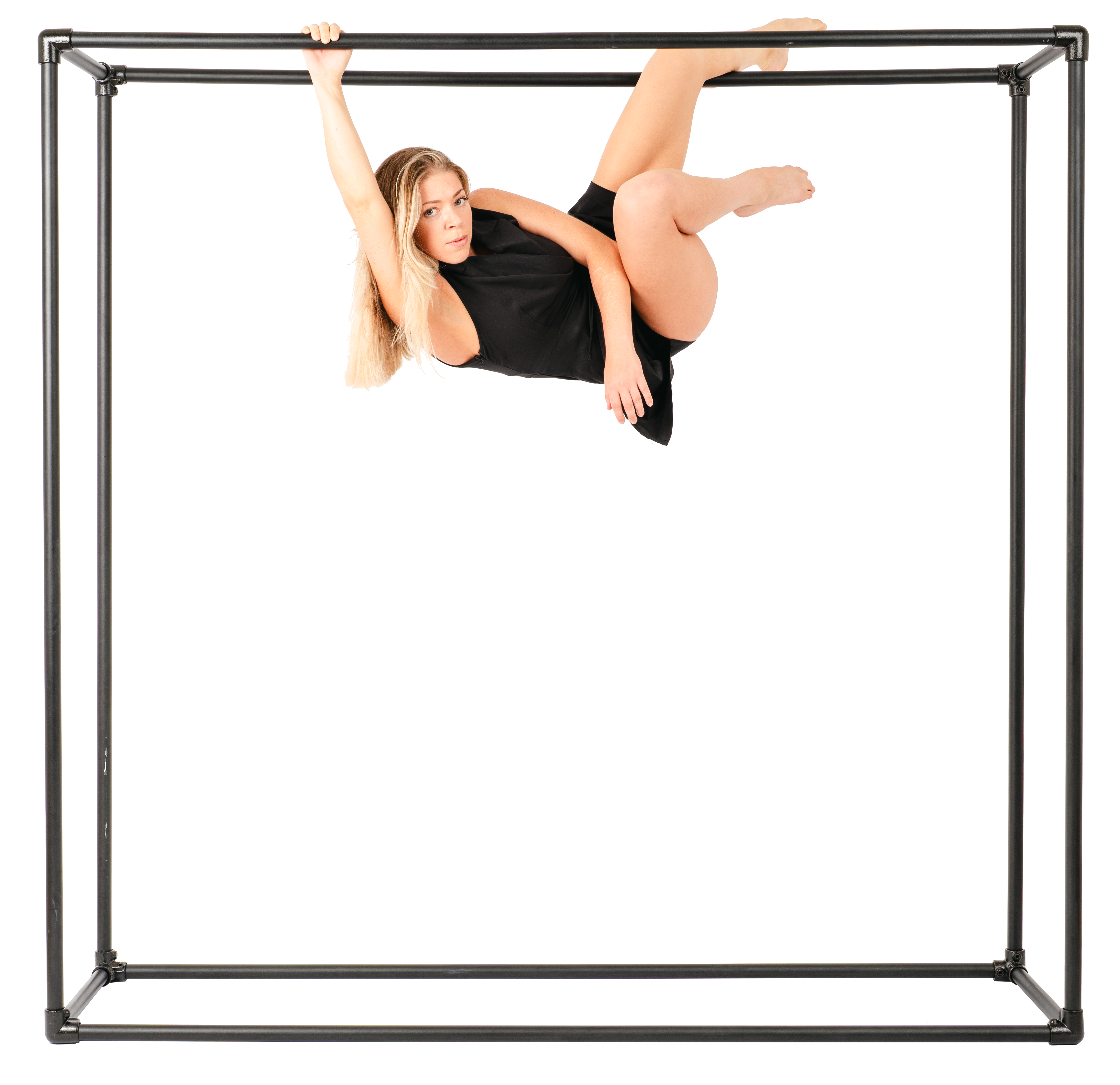 A performer hanging down from some black bars.